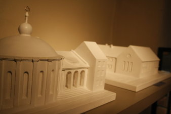 Two plaster models, one showing a domed structure, the other one a plain functional building