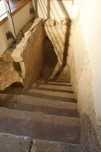 Stairs leading downwards to a basin, which used to hold water for a mikveh 