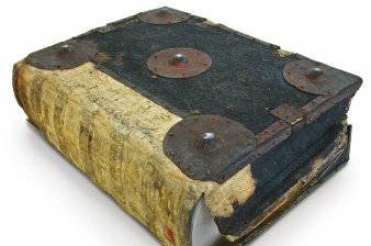 Very large book cover made of leather with metal fittings